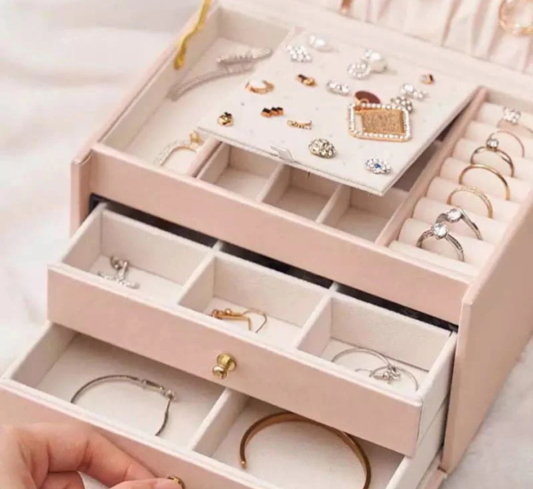 Elegant large-capacity jewelry box with PU leather exterior, velvet lining, built-in mirror, secure lock, and multiple storage compartments.